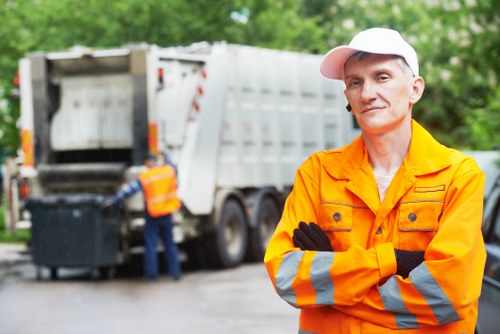 Construction workers managing waste at a site in Crouch End