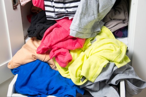 Staff securing a skip load for transport