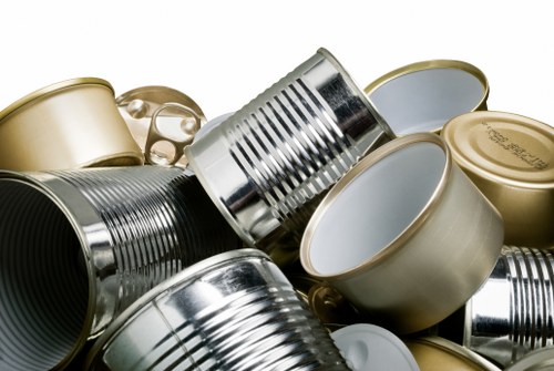 Crew wearing PPE loading a skip safely